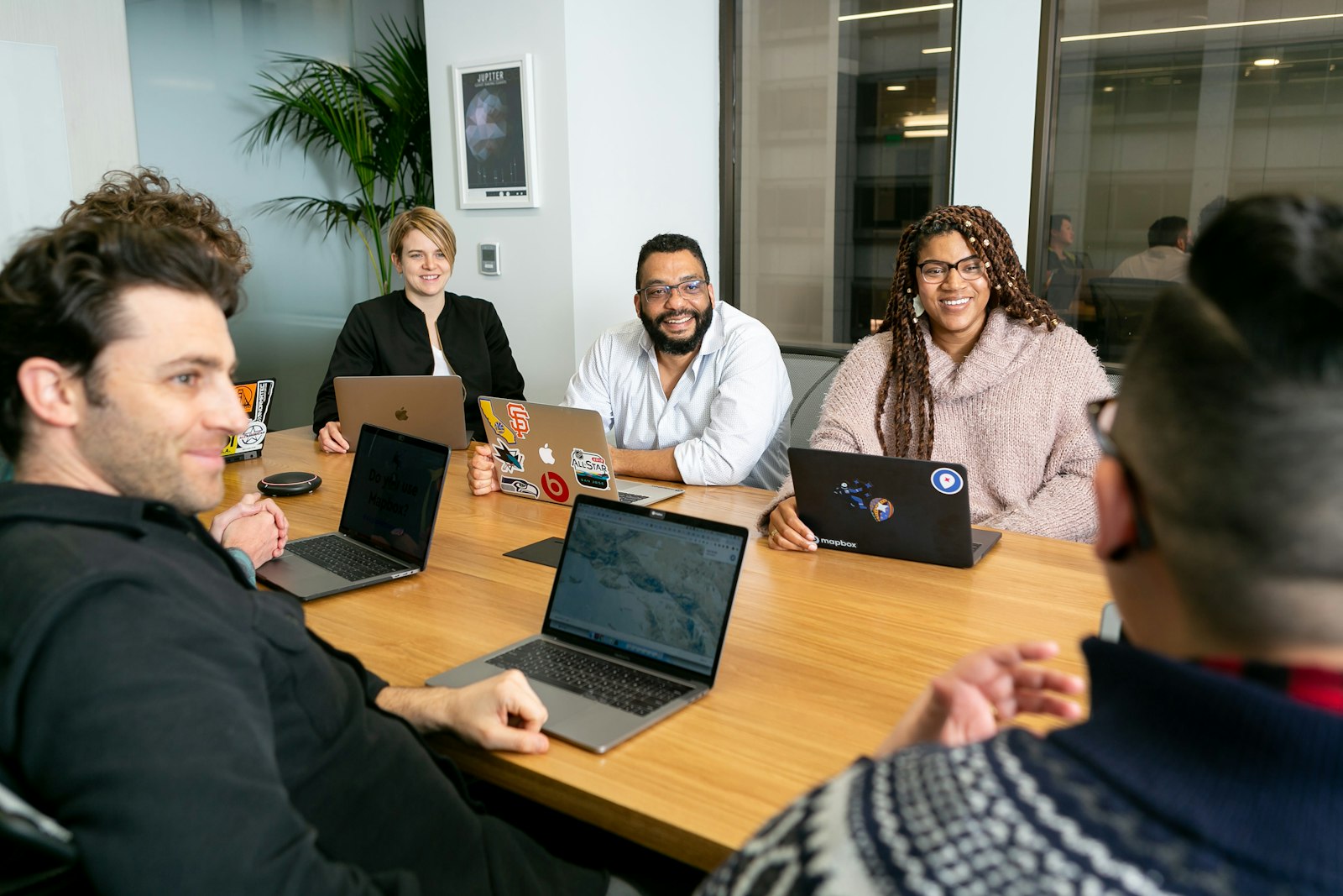 Business professionals collaborating around a table in a modern office