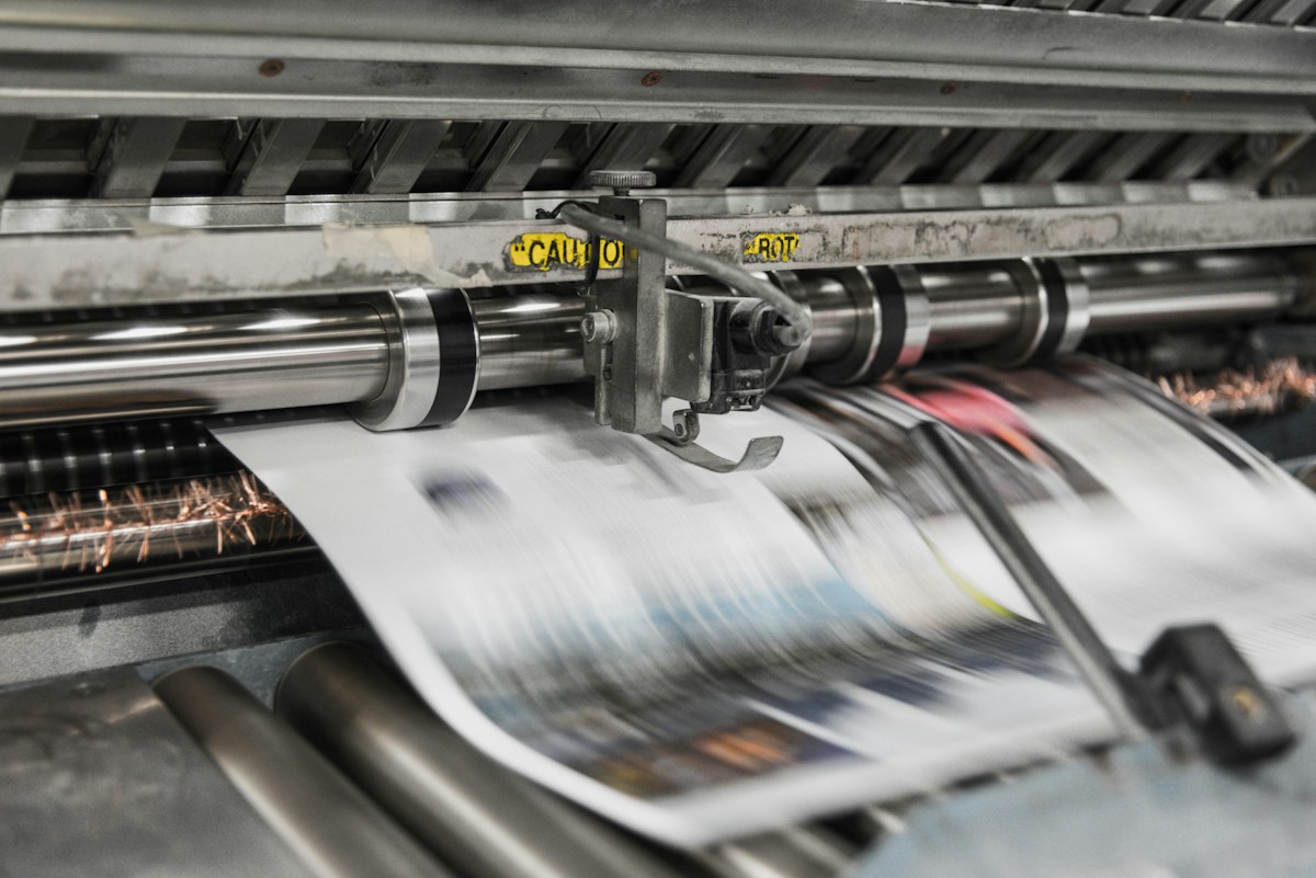 Large-format commercial printing machine producing branded material